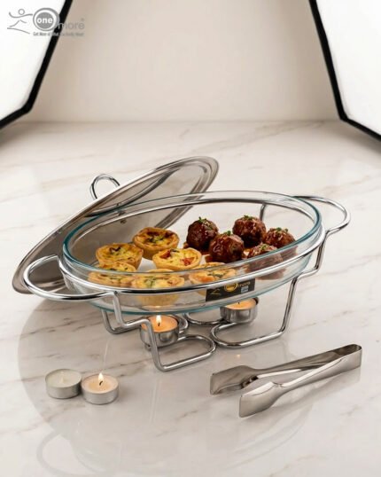 Three Paramount Series glass and stainless steel food warmers in 1.5L, 2L, and 3L sizes arranged on a dining table with tea light candles lit underneath.