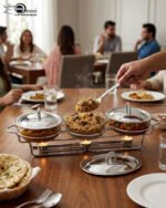Three-section stainless steel food warmer from the Paramount Series featuring three 1.5L glass bowls with metal lids on a silver wire rack with tea light candle burners underneath.