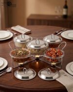 Paramount Series 5-in-1 buffet food warmer featuring one large 2.5L central glass bowl and four 1.5L side glass bowls with stainless steel lids, supported by a chrome metal stand with integrated buffet burners for tea lights.