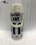 A 1.9-liter Day Days vacuum insulated airpot with a floral garden pattern and brown pump-action lid, standing on a kitchen counter with a blurred home background.