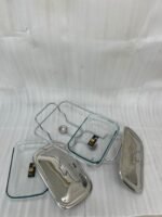 A Paramount Series 2-in-1 stainless steel food warmer with two 1.5-liter glass serving dishes and dual buffet burners, displayed on a marble kitchen countertop.