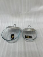 Paramount Series 7-in-1 buffet food warmer set featuring seven clear glass bowls with polished stainless steel lids and a silver metal stand with buffet burners on a decorated dining table.