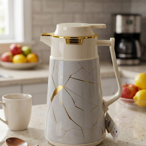 Three elegant 1-liter vacuum flasks in black, grey, and cream colors, featuring a golden Kintsugi-inspired marble pattern on a kitchen countertop.