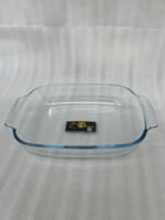 A Paramount Series 3-in-1 buffet food warmer featuring three square glass serving dishes with stainless steel lids on a chrome wire rack, displayed on a kitchen counter and an outdoor dining table with tea light candles lit underneath.