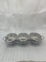 Three-section stainless steel food warmer from the Paramount Series featuring three 1.5L glass bowls with metal lids on a silver wire rack with tea light candle burners underneath.