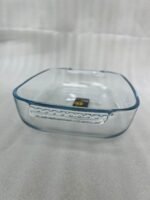 A Paramount Series 3-in-1 buffet food warmer featuring three square glass serving dishes with stainless steel lids on a chrome wire rack, displayed on a kitchen counter and an outdoor dining table with tea light candles lit underneath.