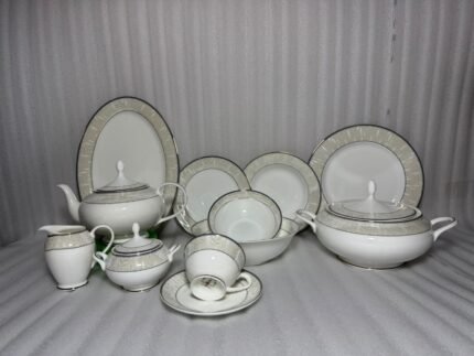 A comprehensive 61-piece Super Bone China dinner set featuring a white finish with a beige leaf pattern border and silver rims, arranged against a neutral background.