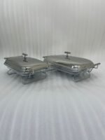 Two Paramount Series stainless steel food warmers in 2L and 3L sizes on a wooden table, featuring glass basins and polished metal lids.