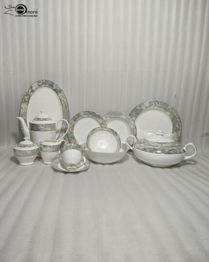 An elegant 61-piece premium super bone china dinner set with grey and gold marbled rims displayed on a warm wooden tabletop, featuring luxury plates, bowls, a covered tureen, and a teapot setup