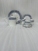 Elevate your hosting experience with this exquisite 24-piece luxury tea set, designed to bring sophisticated elegance to any table. Crafted from high-quality, durable porcelain, this collection features a timeless white finish adorned with a striking blue marble design and delicate gold-rimmed detailing. Perfect for afternoon tea, formal gatherings, or gifting, this comprehensive set provides everything needed for a seamless service. Key Features: Premium Aesthetic: Features a modern blue marble pattern paired with luxurious gold accents. Complete 24-Piece Set: Includes everything required for elegant serving. High-Quality Material: Durable, heat-resistant porcelain suitable for everyday use or special occasions. Set Composition: 1 Dinner Plate 6 Quarter Plates 6 Tea Cups and 6 Saucers 1 Teapot with Lid 1 Sugar Pot with Lid 1 Milk Pot