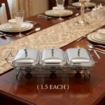 Paramount Series 3-in-1 stainless steel food warmer with three 1.5L glass dishes and buffet burners set on a formal wooden dining table.