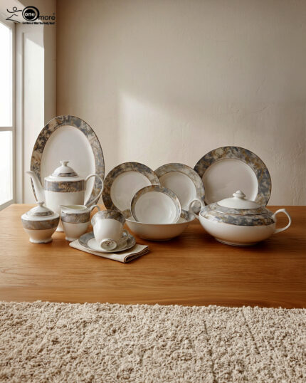 An elegant 61-piece premium super bone china dinner set with grey and gold marbled rims displayed on a warm wooden tabletop, featuring luxury plates, bowls, a covered tureen, and a teapot setup