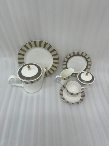 A complete 24-piece luxury porcelain tea set featuring a modern olive green and black striped pattern with gold accents, displayed on a wooden surface