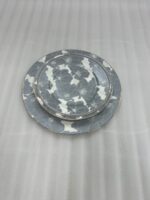 A stacked 18-piece super bone china dinnerware set featuring a grey and white floral pattern on a wooden table, including rice, deep, and quarter plates.