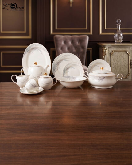 A luxurious white Super Bone China dinner set featuring delicate grey leaf patterns and gold-rimmed detailing, including plates, bowls, a teapot, and a tureen.