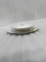 A stacked 18-piece premium super bone china dinner plate set showing 6 quarter plates, 6 deep soup plates, and 6 large rice plates with elegant golden-beige damask borders on a luxury wooden dining table setup