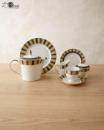 A complete 24-piece luxury porcelain tea set featuring a modern olive green and black striped pattern with gold accents, displayed on a wooden surface