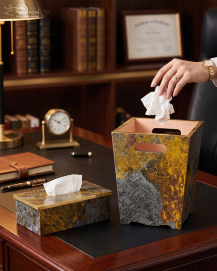 Modern gold and grey textured office dustbin with a matching rectangular tissue box on a premium wooden executive desk.