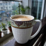 Enjoy the perfect blend of elegance and comfort with this premium bone china mug set. Featuring an intricate, vintage-inspired filigree border in deep purple and gold tones, these mugs bring a touch of royalty to your daily tea or coffee rituals. The lower half of the mug boasts a sophisticated textured grid pattern, providing a modern tactile feel and a secure grip. Crafted for those who appreciate fine craftsmanship, this set is ideal for cozy rainy mornings on the balcony or hosting guests with style. Key Features Premium Bone China: Lightweight yet durable with a smooth, translucent finish. Intricate Artistry: Beautifully detailed ethnic motifs and gold accents for a luxury aesthetic. Ergonomic Design: Large, comfortable handle and a textured body for an enhanced grip. Versatile Use: Perfect for hot tea, coffee, lattes, or hot chocolate. Capacity: Standard size, ideal for a generous serving of your favorite beverage