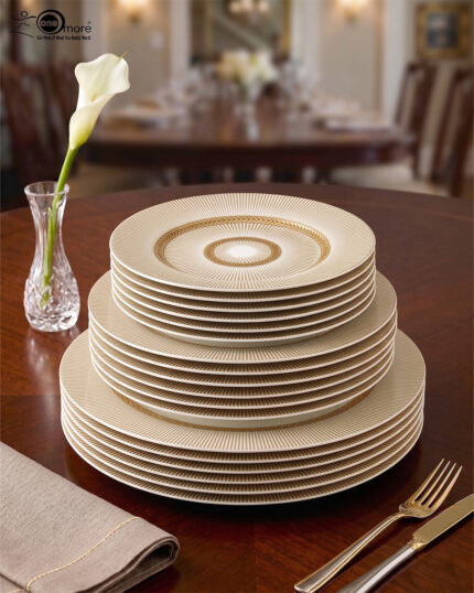 A luxury super bone china dinner set featuring a white base with gold-toned textured borders and metallic accents, displayed on a wooden table in 7.jpg.