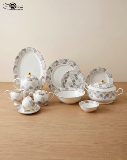 A complete white Super Bone dinner set featuring grey floral patterns and gold accents, including plates, bowls, a teapot, and serving dishes, displayed on a wooden surface in 3.jpg.