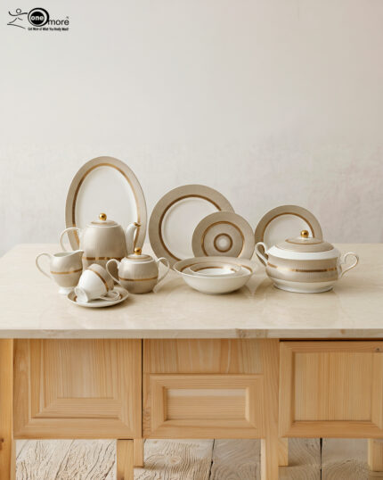 A luxury Super Bone China dinnerware set featuring a white porcelain base with intricate gold vertical ribbing and circular patterns, displayed on a marble countertop in 3.jpg