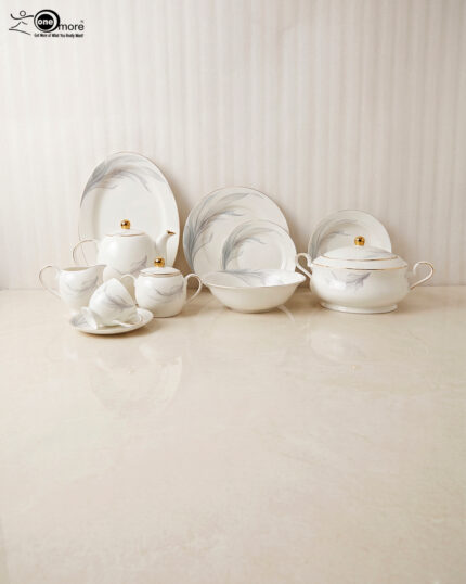 A luxurious white Super Bone China dinner set featuring delicate grey leaf patterns and gold-rimmed detailing, including plates, bowls, a teapot, and a tureen.
