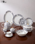 A luxury super bone china dinner set featuring grey floral patterns and gold-tipped lids, displayed on a dark wooden table in "3.jpg"