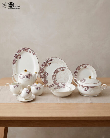 A luxury super bone china dinnerware set featuring a white base with intricate purple leaf patterns and gold accents, displayed on a wooden table