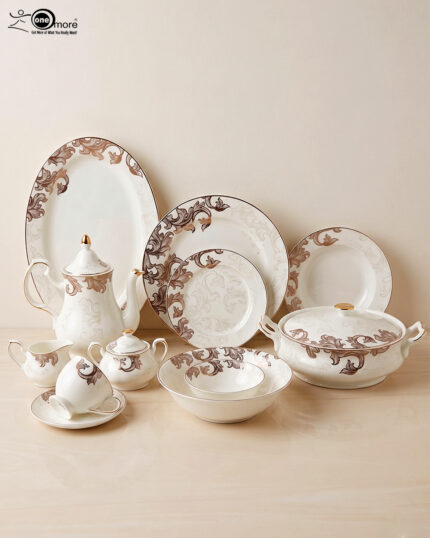 An elegant white super bone china dinner set featuring a classic brown and gold baroque acanthus leaf pattern, including plates, bowls, a teapot, a tureen, and teacups arranged on a light-colored surface