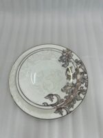 A stack of 18 premium super bone china plates featuring an elegant brown floral pattern on a wooden table, including rice, deep, and quarter plates.