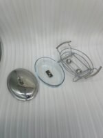 Two Paramount Series stainless steel oval food warmers in 2.4L and 3L sizes on a table runner, featuring glass bowls and polished metal lids.