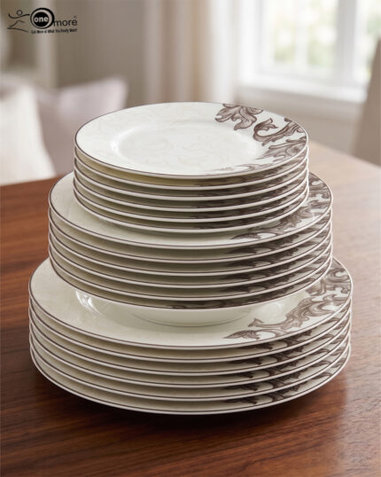 A luxury super bone china dinner set featuring a white base and intricate brown acanthus leaf patterns, including plates, bowls, a teapot, and serving dishes on a wooden table.