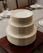 A stacked 18-piece premium super bone china dinner plate set showing 6 quarter plates, 6 deep soup plates, and 6 large rice plates with elegant golden-beige damask borders on a luxury wooden dining table setup