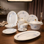 A luxury 61-piece Super Bone China dinner set by Onemore Crockery, elegantly arranged for an 8-person serving on a dark wooden dining table with a floral pattern and gold accents