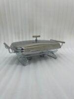 Two Paramount Series stainless steel food warmers in 2L and 3L sizes on a wooden table, featuring glass basins and polished metal lids.
