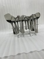 A high-quality 53-piece stainless steel cutlery set arranged elegantly on a dark wood background featuring various spoons, forks, and knives as displayed in 6.jpg.