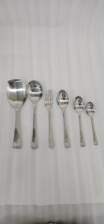 Professional studio photography showing the high-quality finish of the 53-piece stainless steel cutlery set arranged on a wooden surface, as displayed in 8.jpg.