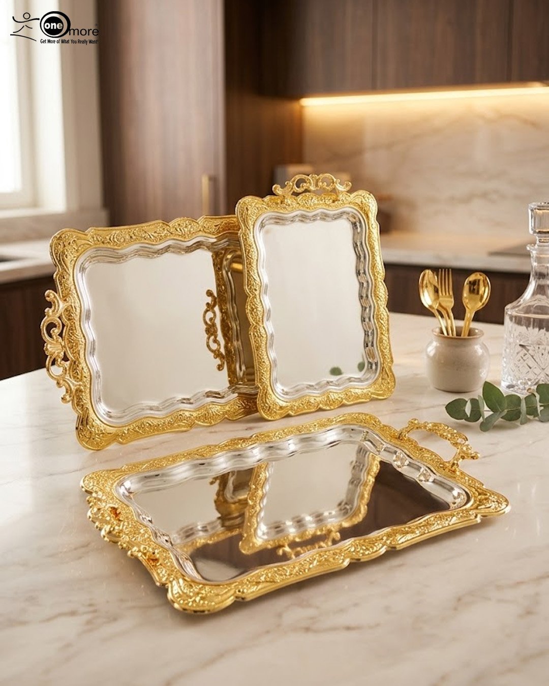 2 An elegant rectangular stainless steel serving tray with a highly reflective mirror finish and intricate center engravings, featuring a luxurious ornate gold border and decorative handles, displayed on a dark wooden table as shown in 1.jpg.
