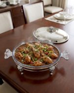 Premium 3-liter stainless steel chafing dish food warmer with decorative ornate stand on a luxury wooden dining table setup by One More.