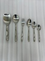 Elevate your dining table with this complete 53-piece cutlery set, expertly crafted to combine durability with timeless elegance. Made from high-quality stainless steel, this set is designed to resist tarnish and rust, ensuring your utensils maintain their shine for years to come. Whether you are hosting a formal dinner or upgrading your daily dining experience, this versatile set provides everything you need for service, organization, and style. Key Features Comprehensive 53-Piece Set: Includes everything required for a full table setting, neatly organized with an included stand for convenient storage and display. Premium Quality Material: Crafted from durable, corrosion-resistant stainless steel. Proudly Made in Pakistan: Supports local craftsmanship with high-grade manufacturing standards. Versatile Collection: Designed to handle every course, from soups and rice to main entrees. Set Breakdown: 12 x Table Spoons 12 x Tea Spoons 12 x Forks 12 x Knives 2 x Rice Serving Spoons 2 x Soup Serving Spoons 1 x Cutlery Stand