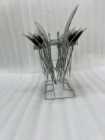 An elegant assortment of stainless steel flatware, including various spoons, forks, and knives arranged on a wooden table as featured in 6.jpg, representing a complete 53-piece dining set.