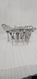 Professional studio photography showing the high-quality finish of the 53-piece stainless steel cutlery set arranged on a wooden surface, as displayed in 8.jpg.