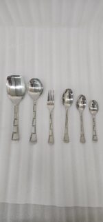 The image 6.jpg displays a selection of items from a 37-piece stainless steel cutlery set, neatly arranged on a wooden background, showcasing the sleek design and finish of the spoons, forks, and serving utensils.