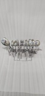 Professional studio photography showing the high-quality finish of the 53-piece stainless steel cutlery set arranged on a wooden surface, as displayed in 8.jpg.