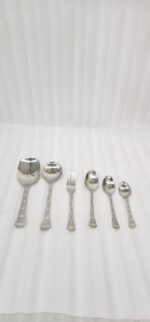 The image 6.jpg displays a selection of items from a 37-piece stainless steel cutlery set, neatly arranged on a wooden background, showcasing the sleek design and finish of the spoons, forks, and serving utensils.