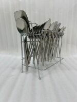 A high-angle view of a complete 53-piece stainless steel cutlery set arranged neatly on a wooden table, as displayed in 7.jpg