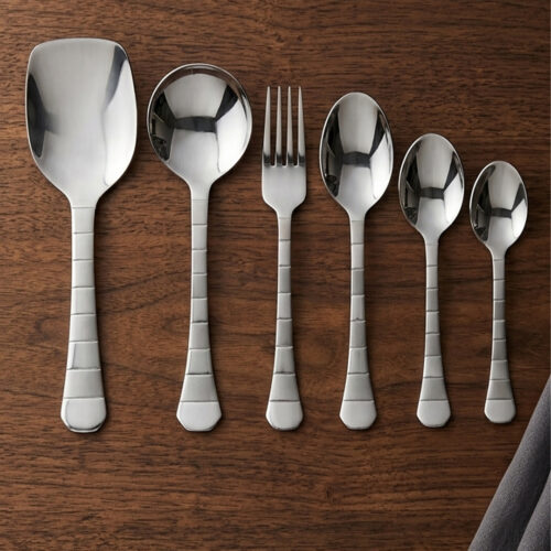 The premium 53-piece stainless steel cutlery collection featured in 6.jpg, displayed neatly on a wooden table to highlight the polished finish and design.