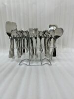 A high-quality 53-piece stainless steel cutlery set featuring elegant patterned handles, displayed on a grey fabric surface as shown in 9.jpg.