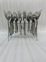 A high-angle view of a complete 53-piece stainless steel cutlery set arranged neatly on a wooden table, as displayed in 7.jpg